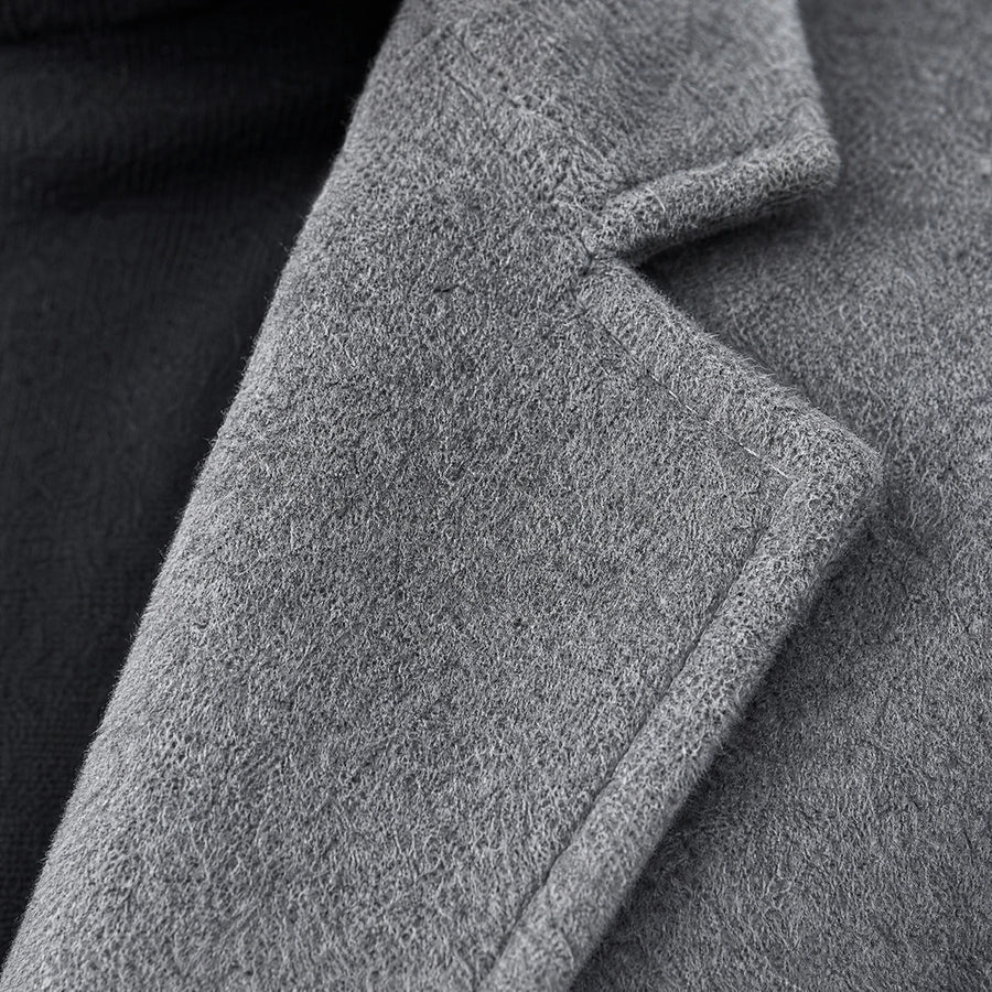 Manteau mi-long uni à revers crantés vintage - close-up détail matière