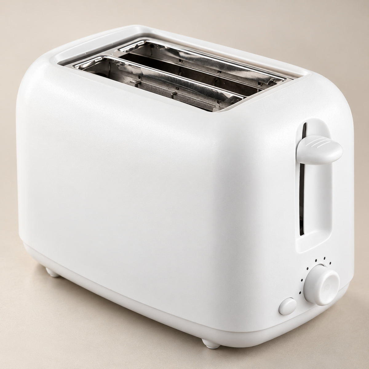 Gros plan sur le tiroir à miettes amovible et la minuterie mécanique du grille-pain vintage blanc Imagen